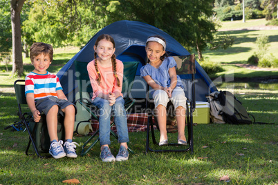 Happy siblings on a camping trip