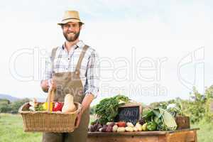 Farmer holding basket of vegetables at market