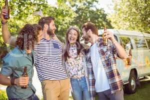 Hipster friends having a beer together