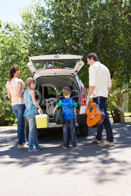 Happy family getting ready for road trip