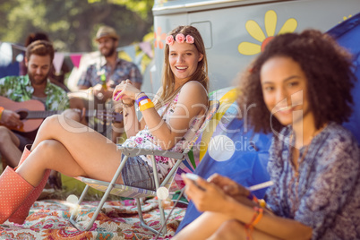 Carefree hipster relaxing on campsite