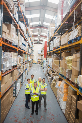 Warehouse team smiling at camera