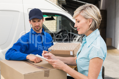 Happy delivery man with customer