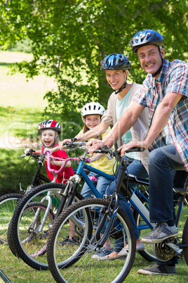 Happy family on their bike at the park