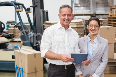 Warehouse manager and her boss working together