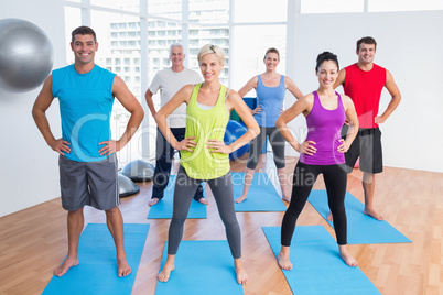 Happy people exercising in gym class