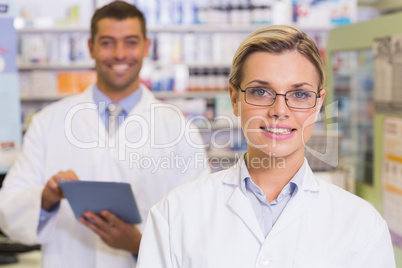 Pharmacists looking at camera