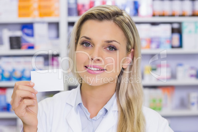 Pharmacist showing medicine box