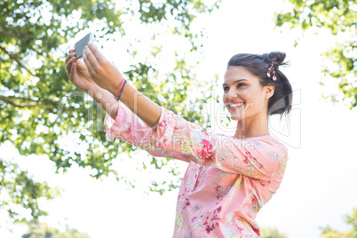 Pretty brunette taking a selfie