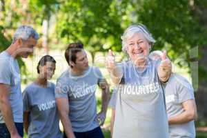 Happy volunteer grandmother with thumbs up