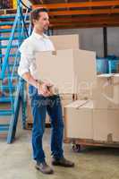 Warehouse managers loading a trolley