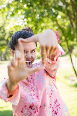 Pretty brunette framing with hands