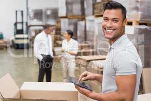 Smiling manager using digital tablet