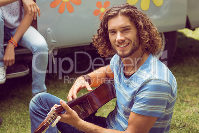 Hipster friends in camper van at festival