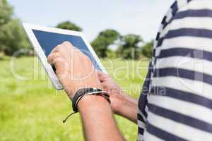 Man using a tablet in the park