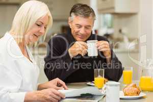 Mature couple having breakfast together