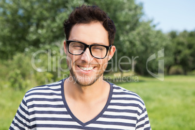 Handsome hipster smiling at camera