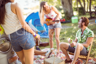 Hipsters having fun in their campsite