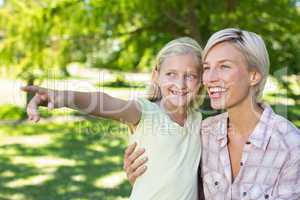 Happy blonde with her daughter in the park