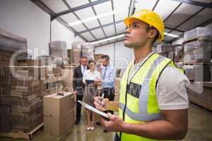 Warehouse manager checking his inventory