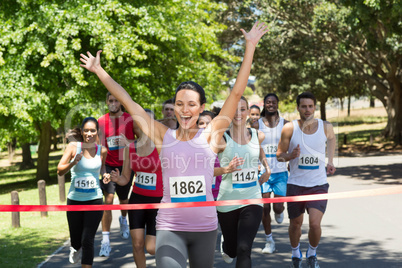 Fit people running race in park