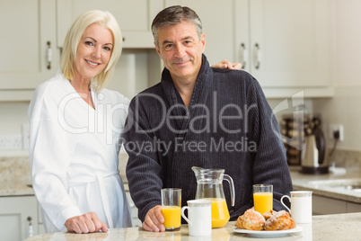 Mature couple having breakfast together