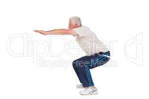 Senior man doing a squat