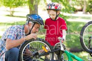 Father and son fixing a bike