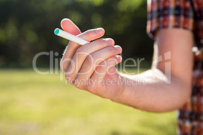 Hipster smoking an electronic cigarette