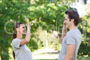 Happy volunteer couple high fiving