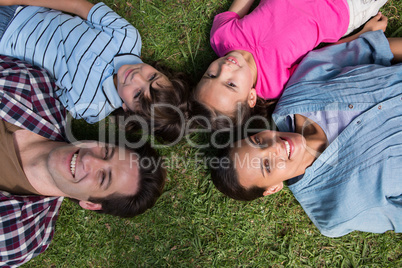 Happy family smiling at camera