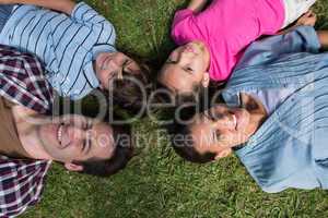 Happy family smiling at camera