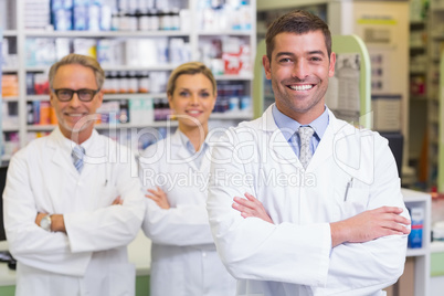 Team of pharmacists smiling at camera