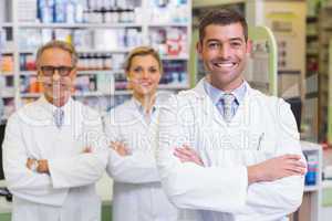 Team of pharmacists smiling at camera