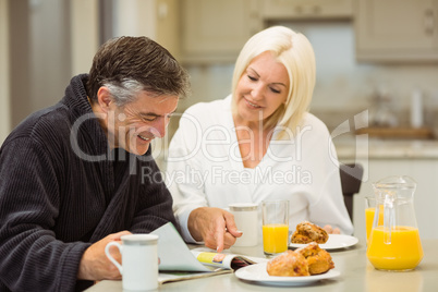 Mature couple having breakfast together