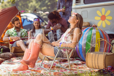 Carefree hipster having fun on campsite