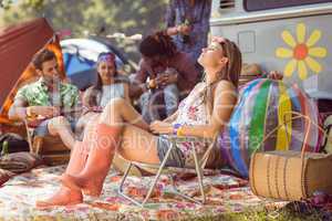 Carefree hipster having fun on campsite