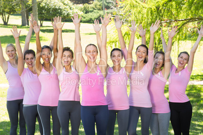 Smiling women in pink for breast cancer awareness