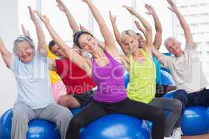 Happy people exercising in gym class