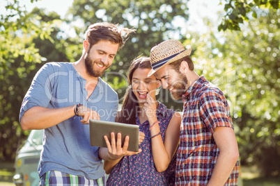 Hipster friends looking at their selfie