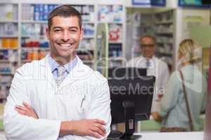 Smiling pharmacist looking at camera