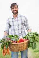Handsome farmer with basket of veg