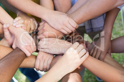 Friends putting their hands together