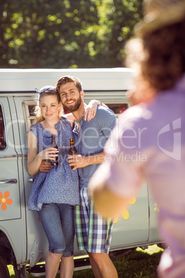 Hipster friends posing and drinking