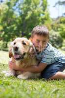 Little boy with his dog in the park