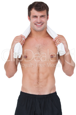 Fit shirtless man smiling at camera