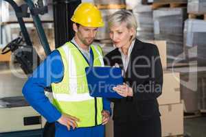 Forklift driver talking with his manager