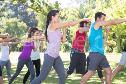 Fitness group working out in park