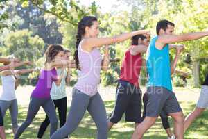 Fitness group working out in park