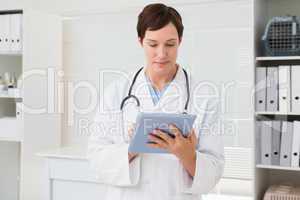 Veterinarian and holding tablet